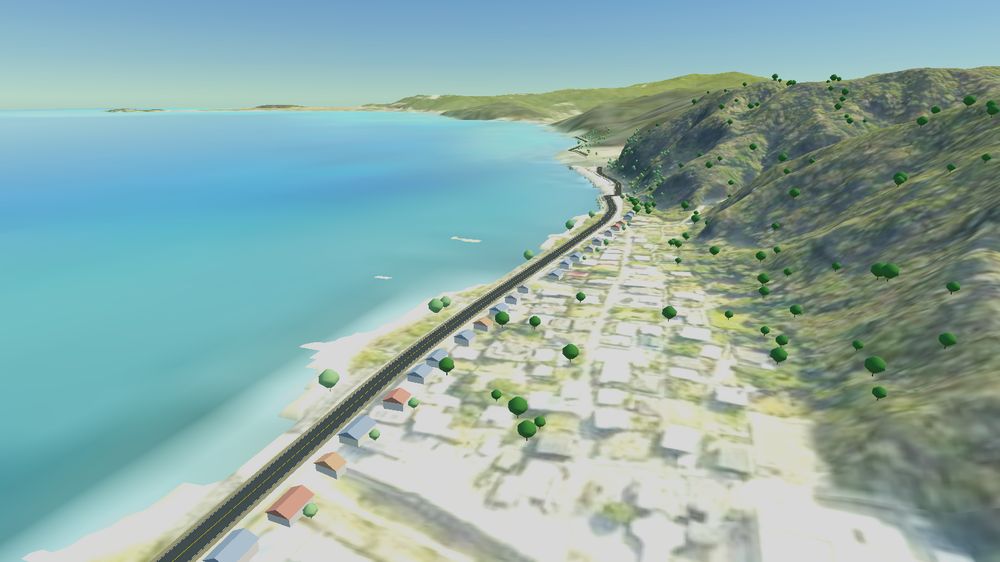 沖縄2026 コース。エメラルド色の海に沿って続く道を上空から見た画面